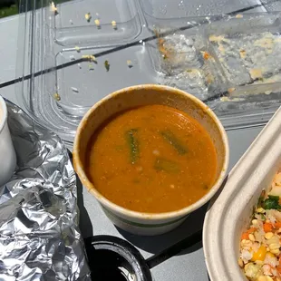 a bowl of soup and a bowl of rice