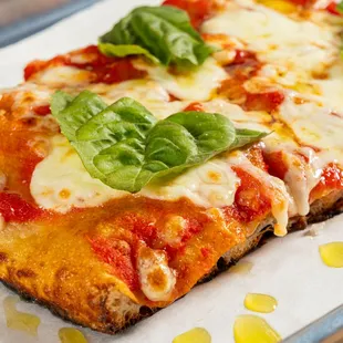 Margarita Slice - Tomato sauce, mozzarella, basil, evoo