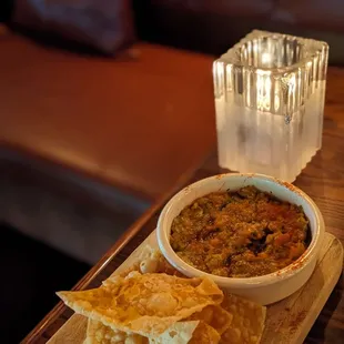 a bowl of chili and tortilla