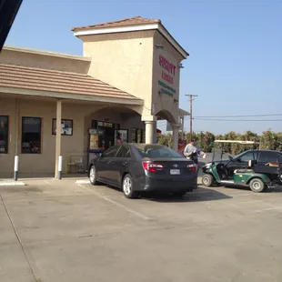 a car parked in front of the store