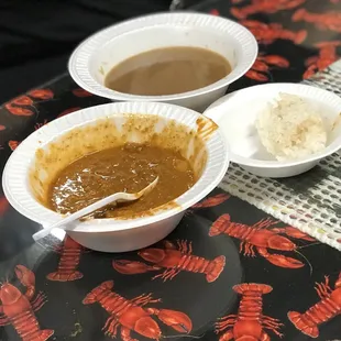 two bowls of soup and a spoon