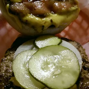 The fully assembled bacon cheeseburger, needs ketchup, mustard etc for flavor.