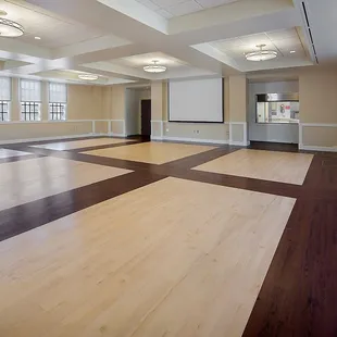 main room can utilize 16 round tables with 8 chairs each. Banquet Seating for 128.