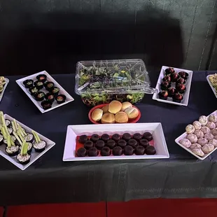 a table with a variety of desserts