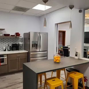Modern kitchen with complimentary water and coffee