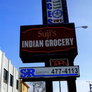a sign for suji&apos;s indian grocery