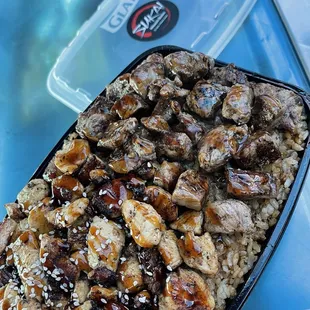 a plate of rice and meat
