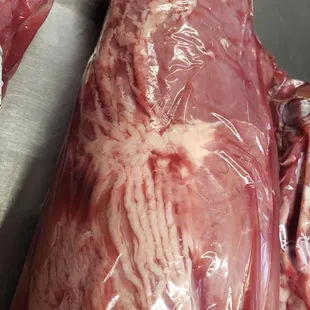 raw meat wrapped in plastic