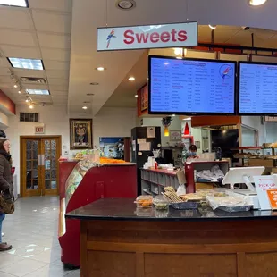 a woman standing at the counter