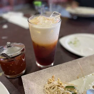 a plate of noodles and a drink