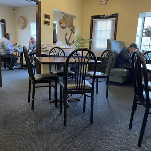 a dining room with a table and chairs
