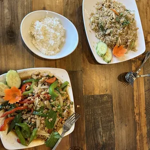 Thai fried rice with chicken and pad Kaprow stir fry with chicken and added bell peppers.