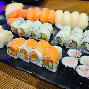 AYCE menu (top row L-R: escolar &amp; salmon sashimi, salmon &amp; escolar nigiri, Philly, smoked salmon, snow white, crazy salmon, yellowtail)