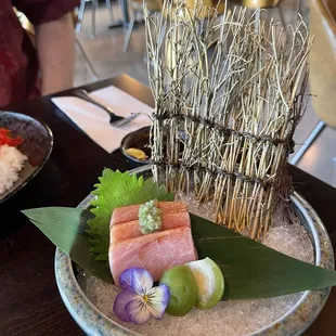 Fatty tuna sashimi with a baby peach.