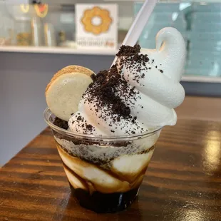 Soft Ice Cream with True Milk, Black Sugar Boba, Orem Crumbs, and Macaron.