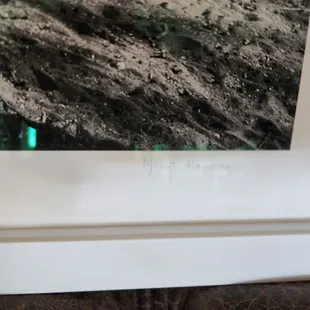 Signature of photographer on the framed photo