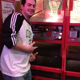 a man standing in front of a basketball game