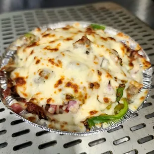 Crustless pizza in a 9-in pan with toppings that you choose