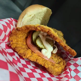 Giant tenderloin, so big we have to fold it in half and put the toppings inside