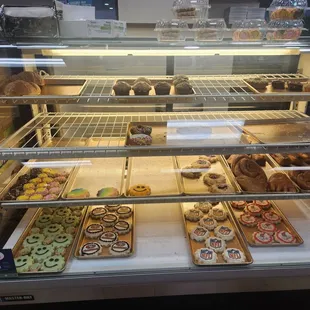 a variety of pastries in a display case