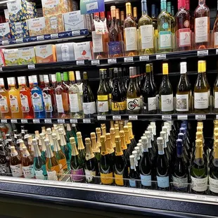 bottles of wine on display in a grocery store