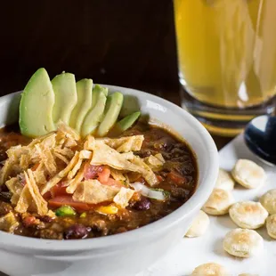 a bowl of chili and tortilla