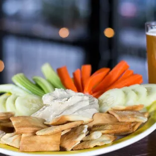 a plate of chips and vegetables