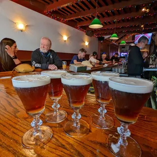 a row of glasses of beer