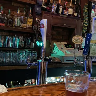 a glass of beer on the bar