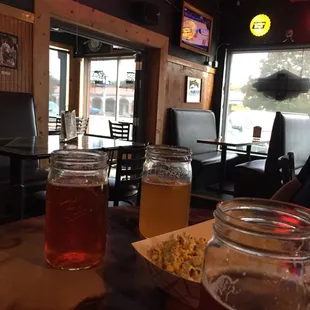 two jars of beer on a table