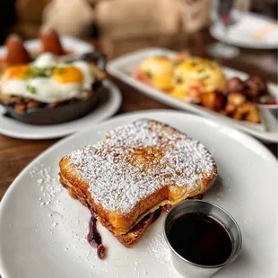 a plate of french toast and a cup of coffee