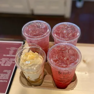 a variety of drinks on a tray