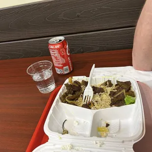 a meal in a styrofoam container