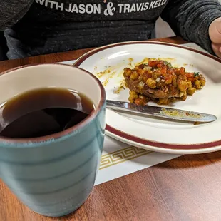 Spiced black tea with alu tikki chat in the background l, which was very good.