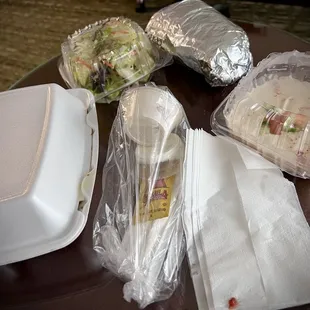 Showing the packaging of my to go order. This is the combination Shawerma Combo Plate and a small order of Hummus