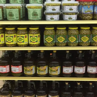 a shelf full of jars of pickles