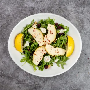 Arugula Pear Salad
Fresh arugula topped with thinly sliced pear, walnuts, tangy blue cheese, and dried cranberries. sweet, savory flavors