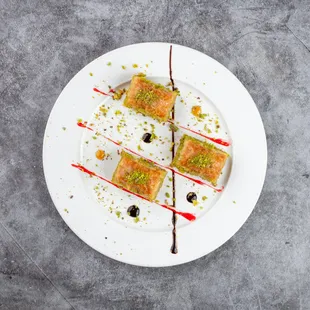 Baklava
A traditional Turkish dessert featuring 40 layers of hand-crafted pastry,  filled with pistachios and drizzled with honey syrup