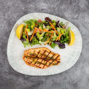 Grilled Salmon Fillet,
Perfectly grilled salmon fillet with a golden, crispy finish served alongside a fresh and vibrant seasonal salad
