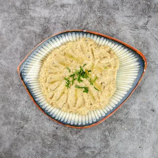 Baba Ghanoush
Char-grilled, smoked eggplant purée blended with tahini, garlic, olive oil, and a hint of lemon juice. A classic