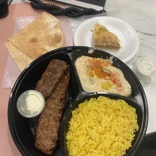 Beef Kabob with Yellow Rice Humus with Olive oil and Pepper and a Pistachio Baklava