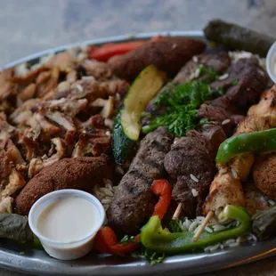 a platter of meat and vegetables