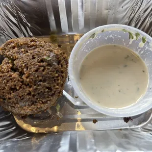 The final falafel and the last drops of the tahini sauce