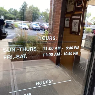 Hours by the door