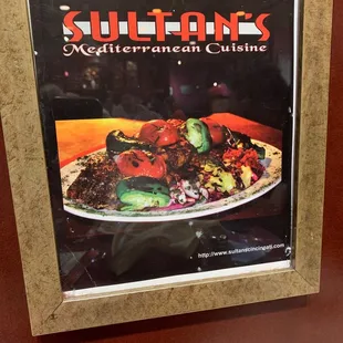 Probably the cover for the restaurant&apos;s previous menu.  The food is as good as the flame seared platter in the photo!