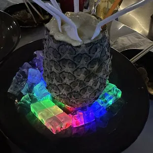 a pineapple decorated with ice cubes