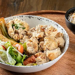 Chicken Kabob Entrée: 2 Skewers of Chicken Breast Chunks, Garlic, Pickles, French Fries, Pitta Bread and Vermicelli Rice. *Served with