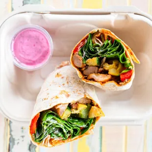 Organic Chicken Wrap. Comes with sumac yogurt sauce and hot sauce.