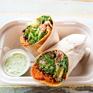 Red Lentil Balls Wrap. Comes with fresh herbs yogurt sauce and hot sauce.