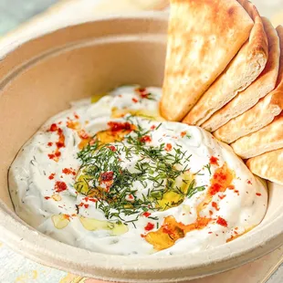 Cacik (Tzatziki) with Warm Pita - Labne, Persian cucumber, dried mint, fresh dill, and lemon zest served with warm pita